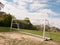 An Empty and Unused Goal Post with A White Net in the Middle of