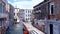 Empty venetian gondola on a canal in Venice, Italy