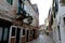 Empty Venetian street curves away from camera