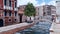 Empty Venice street with ancient bridge over canal