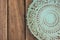 Empty vintage blue plate on wood table top view, flat lay