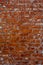 Empty Vintage Red Brick Wall Texture. Building Facade With Scratch Damage