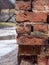 Empty Vintage Red Brick Wall Texture. Building Facade With Scratch Damage outdoor, rainy day