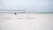 Empty volleyball field in Pensacola Beach, Gulf of Mexico in background.