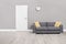 Empty waiting room with a modern gray sofa