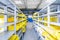 Empty warehouse interior with shelves, pallets , boxes and equipment.