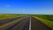 Empty West Texas Highway Under Blue Sky