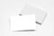 Empty white business card stack on light desktop. Info, address and message concept. Mock up, 3D Rendering