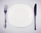 Empty white dish knife and fork