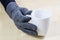 Empty white mug with gloves. Hands in warm gloves holding a chin