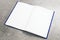 Empty white notepad on concrete surface