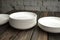 Empty white plate on a wooden loft table