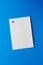 Empty white sheet is pinned to a blue background