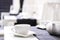 Empty white tea set, cup, saucer and teapot on the table. Porcelain dishes, selective focus