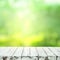 Empty white wood table top on blur tree garden in morning