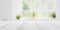 Empty white wooden table top with out of focus lights bokeh green garden background behind window