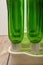 Empty wine bottles in a plastic dryer on the table