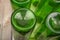 Empty wine bottles in a plastic dryer on the table. Close up