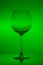 Empty wine glass on green background, empty wineglass