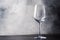 Empty wine glass for white or rose wine, gray background, copy space, selective focus