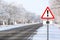 Empty winter road with sign