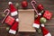 Empty wishlist for Santa Claus on wooden table with Christmas decorations. Top view.