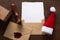 Empty wishlist for Santa Claus on wooden table with Christmas decorations. Top view.