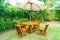 empty wood outdoor patio table and chair in home garden