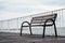 Empty  wood sitting  bench on a  pontoon bridge      at seashore.  Concept of loneliness and contemplation