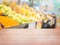 Empty wood table on blur of supermarket, Fruit Department, For montage product display.