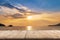 Empty wood table and landscape of sunset on the coast sea, waves with display montage