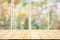 Empty wood table top with kitchen window abstract blur colorful rose flowers in the garden natural background