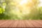 Empty wood table top on nature green blurred background at garden,space for montage show products