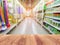 Empty wood table top on shelf in supermarket blurred background