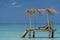 Empty wooden beach chairs on the tropical beach, vacation. Traveler dreams concept