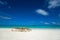 Empty wooden beach chairs on the tropical beach, vacation. Traveler dreams concept