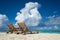 Empty wooden beach chairs on the tropical beach, vacation. Traveler dreams concept