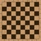 Empty wooden brown chess board
