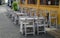 Empty wooden chairs and tables outside the restaurant in the morning, quiet and calm cobblestone Streets in Galle fort