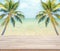 Empty wooden with coconut tree and sea background for product display.