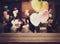 Empty wooden counter with blurred people in the banquet room with colorful balloon