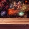 Empty wooden deck table over fireworks background. New Year eve celebration