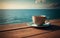 Empty wooden deck table over ocean background with glass cup of tea and saucer on wooden table, a pleasant relaxing drink