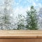 Empty wooden deck table over winter nature background