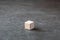 Empty wooden dice on gray background