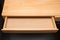 An empty wooden drawer isolated on black background