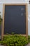 Empty wooden framed chalkboard display for restaurant menus at Tenedos Bozcaada Island by Aegean Sea