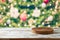 Empty wooden log  on rustic table over Christmas tree festive bokeh background.  Christmas and New Year mock up for design and