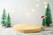 Empty wooden log  on rustic table over festive winter  background.  Christmas and New Year mock up for design and product display