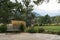 Empty wooden park bench in garden